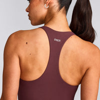 SoftMotion™ Racer Back Mid Tank Top with Built in Bra Shelf with Grey Logo | Velvet Mocha