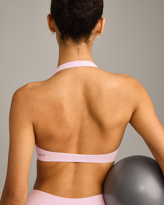 SoftMotion™ Minimal Halter Neck Bralette with Grey Logo | Soft Girl Pink