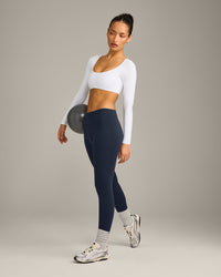 SoftMotion™ Scoop Neck Long Sleeve Crop Top with Built in Bra Shelf with Grey Logo | White