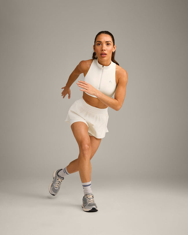 EasyLift™ Zip High Neck Sports Bra with Grey Logo | Marshmallow White