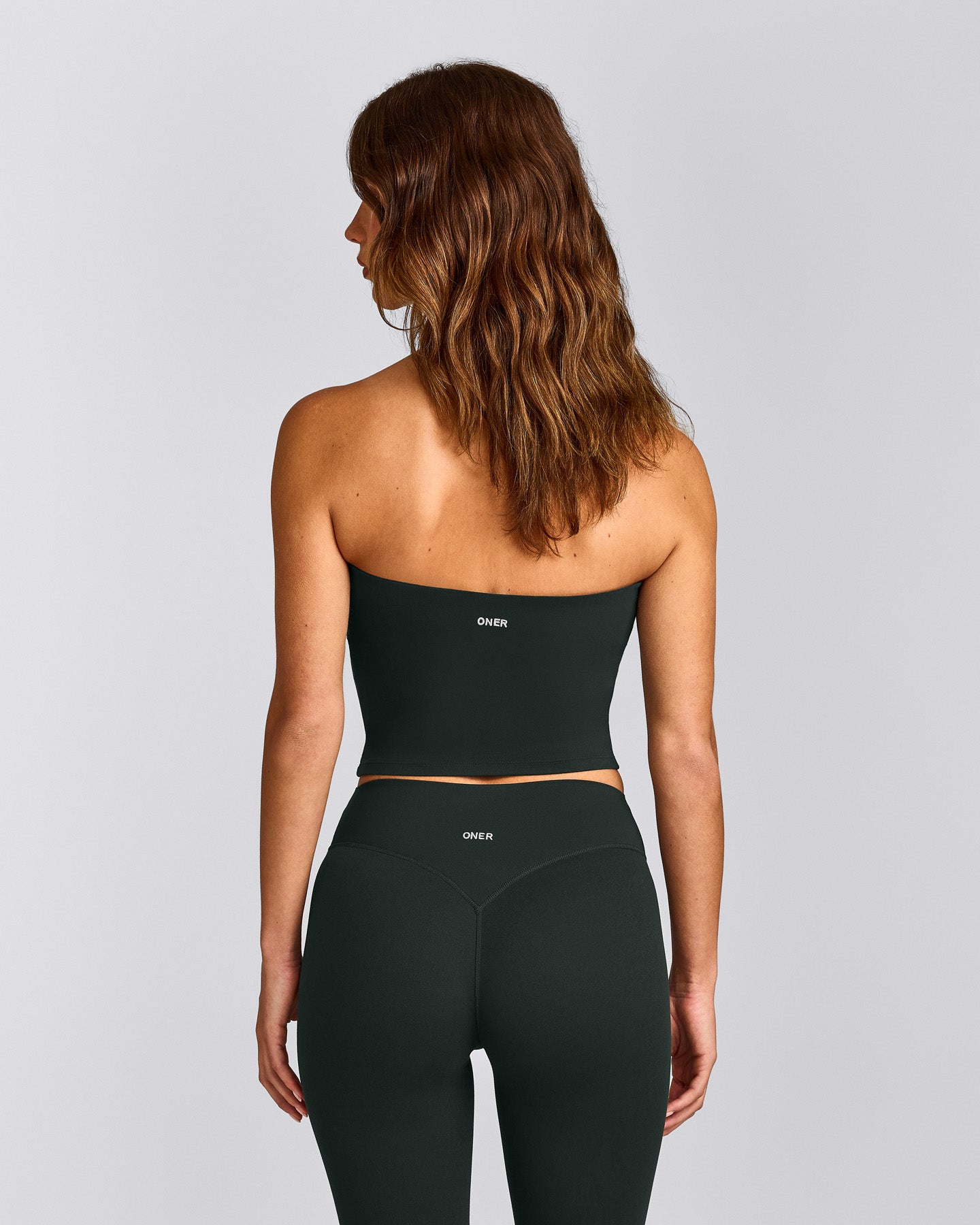 SoftMotion™ Bandeau Mid Tank Top with Built in Bra Shelf with Grey Logo | Emerald Noir