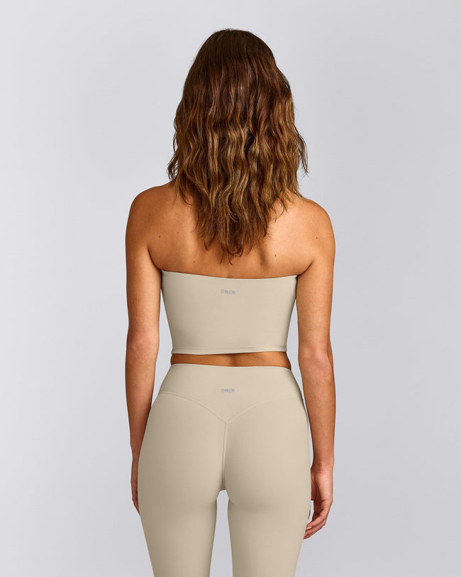 SoftMotion™ Bandeau Mid Tank Top with Built in Bra Shelf with Grey Logo | Oatmeal