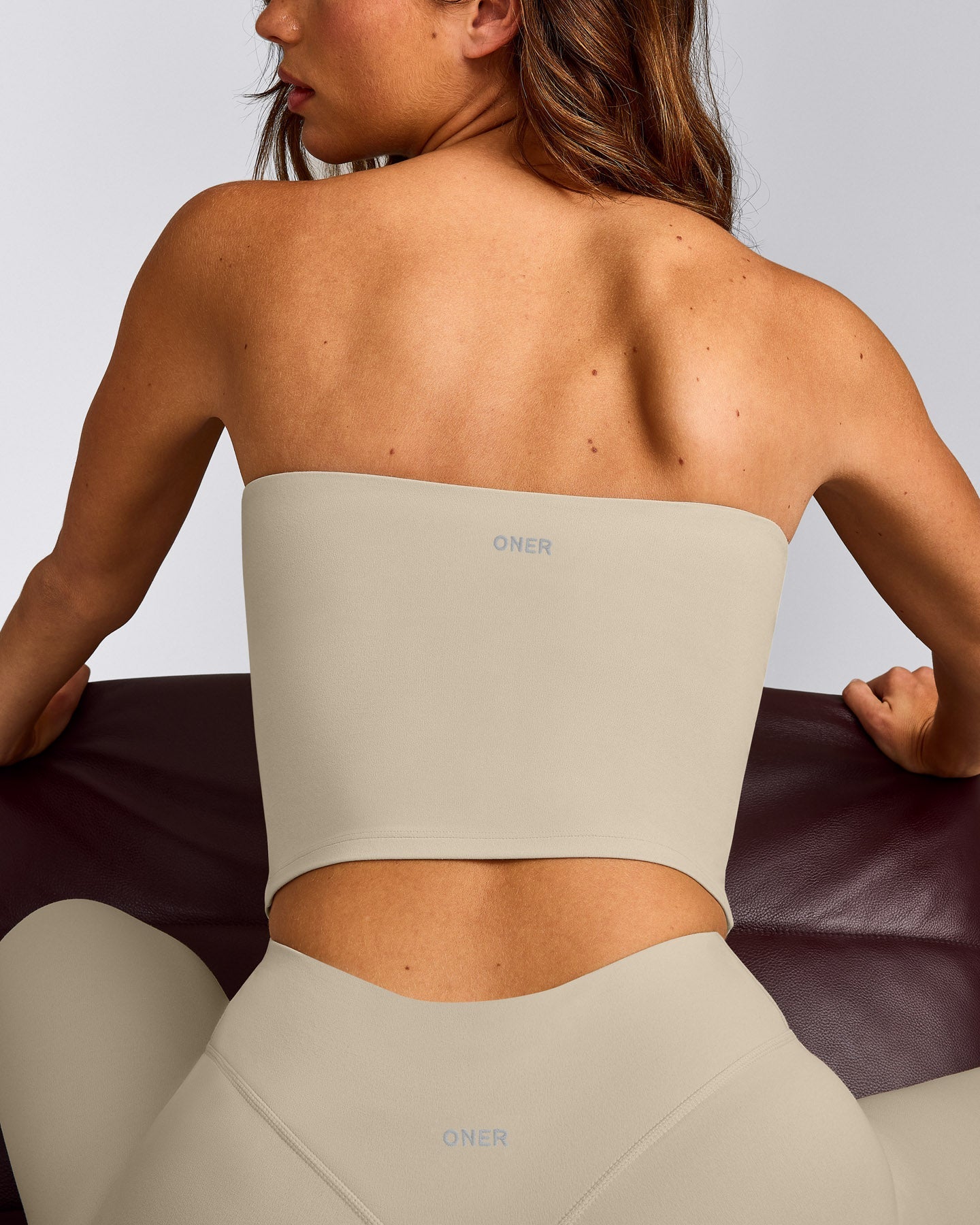 SoftMotion™ Bandeau Mid Tank Top with Built in Bra Shelf with Grey Logo | Oatmeal