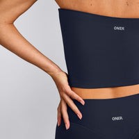 SoftMotion™ Bandeau Mid Tank Top with Built in Bra Shelf with Grey Logo | True Blue