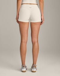 SoftMotion™ Double Layer Mid Rise Shorts 4" with Grey Logo | Marshmallow White