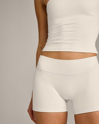SoftMotion™ Double Layer Mid Rise Shorts 4" with Grey Logo | Marshmallow White