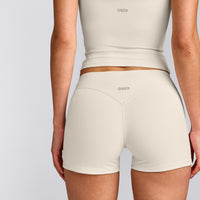 SoftMotion™ Double Layer Mid Rise Micro Shorts 4" with Grey Logo | Marshmallow White