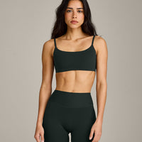 SoftMotion™ Strappy Sports Bra with Grey Logo | Emerald Noir