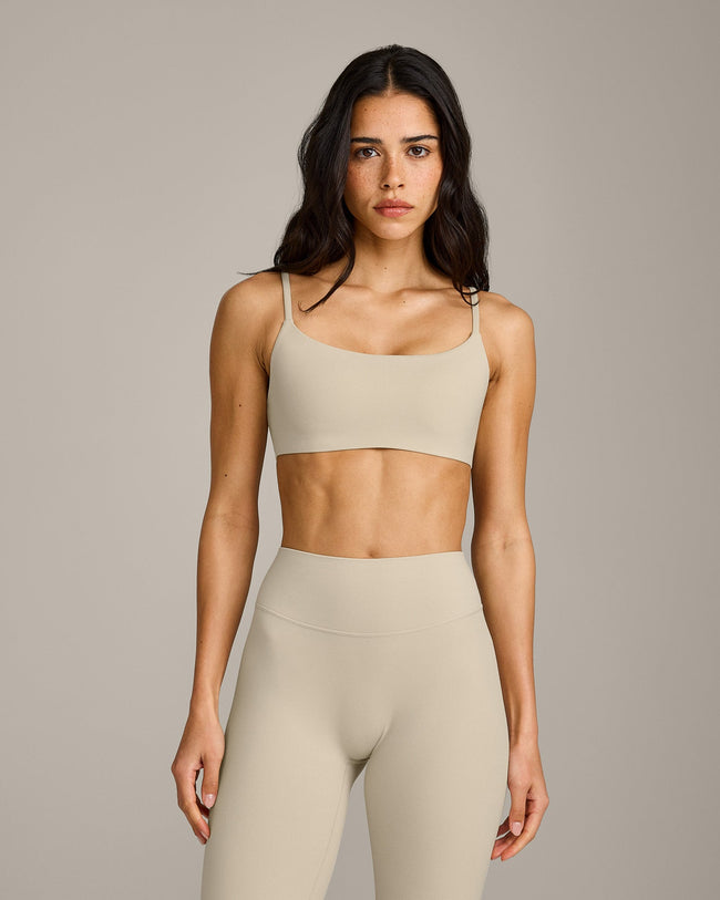 SoftMotion™ Strappy Sports Bra with Grey Logo | Oatmeal