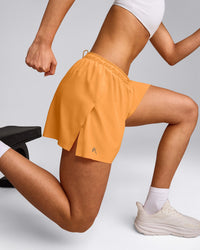 AirMove™ Lined Shorts 4" with Pocket and Reflective Logo | Powdered Orange