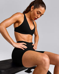 UnifiedMove™ Cross Back Sports Bra with Reflective Logo | Black