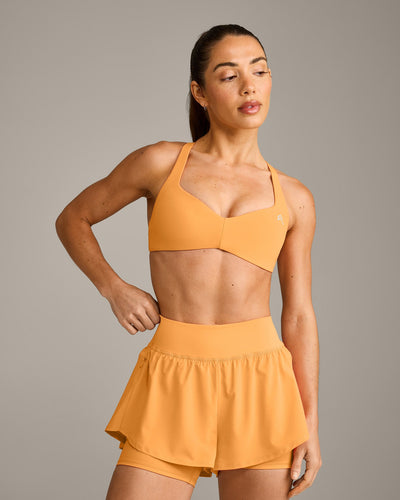 UnifiedMove™ T Back Minimal Bralette with Reflective Logo | Powdered Orange