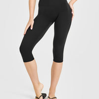 SoftMotion™ High Waisted Capri Leggings with White Logo | Black
