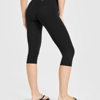 SoftMotion™ High Waisted Capri Leggings with White Logo | Black