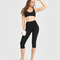 SoftMotion™ High Waisted Capri Leggings with White Logo | Black