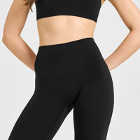 SoftMotion™ High Waisted Capri Leggings with White Logo | Black