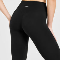 SoftMotion™ High Waisted Capri Leggings with White Logo | Black