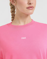Raising The Bar Graphic Unisex T-Shirt | Peony Pink