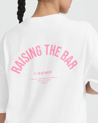 Raising The Bar Graphic Unisex T-Shirt | White