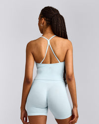 EnhanceLift™ Seamless Strappy Racer Tank Top with Built in Bra Shelf with Grey Logo | Cloud Blue