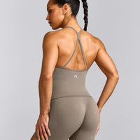 EnhanceLift™ Seamless Strappy Racer Tank Top with Built in Bra Shelf with Grey Logo | Warm Minky