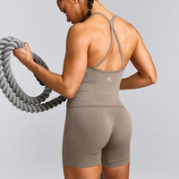 EnhanceLift™ Seamless Strappy Racer Tank Top with Built in Bra Shelf with Grey Logo | Warm Minky
