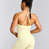 EnhanceLift™ Seamless Strappy Racer Tank Top with Built in Bra Shelf with Grey Logo | Pastel Yellow