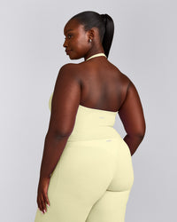 SoftMotion™ Halter Neck Mid Tank Top with Built in Bra Shelf with Grey Logo | Pastel Yellow