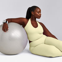 SoftMotion™ Halter Neck Mid Tank Top with Built in Bra Shelf with Grey Logo | Pastel Yellow