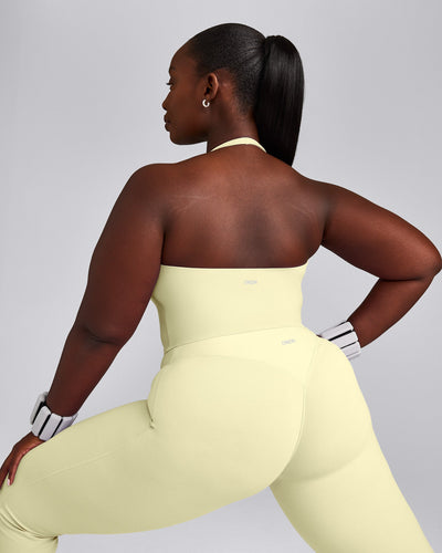 SoftMotion™ Halter Neck Mid Tank Top with Built in Bra Shelf with Grey Logo | Pastel Yellow