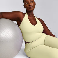 SoftMotion™ Halter Neck Mid Tank Top with Built in Bra Shelf with Grey Logo | Pastel Yellow