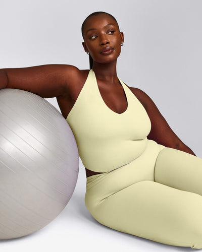 SoftMotion™ Halter Neck Mid Tank Top with Built in Bra Shelf with Grey Logo | Pastel Yellow
