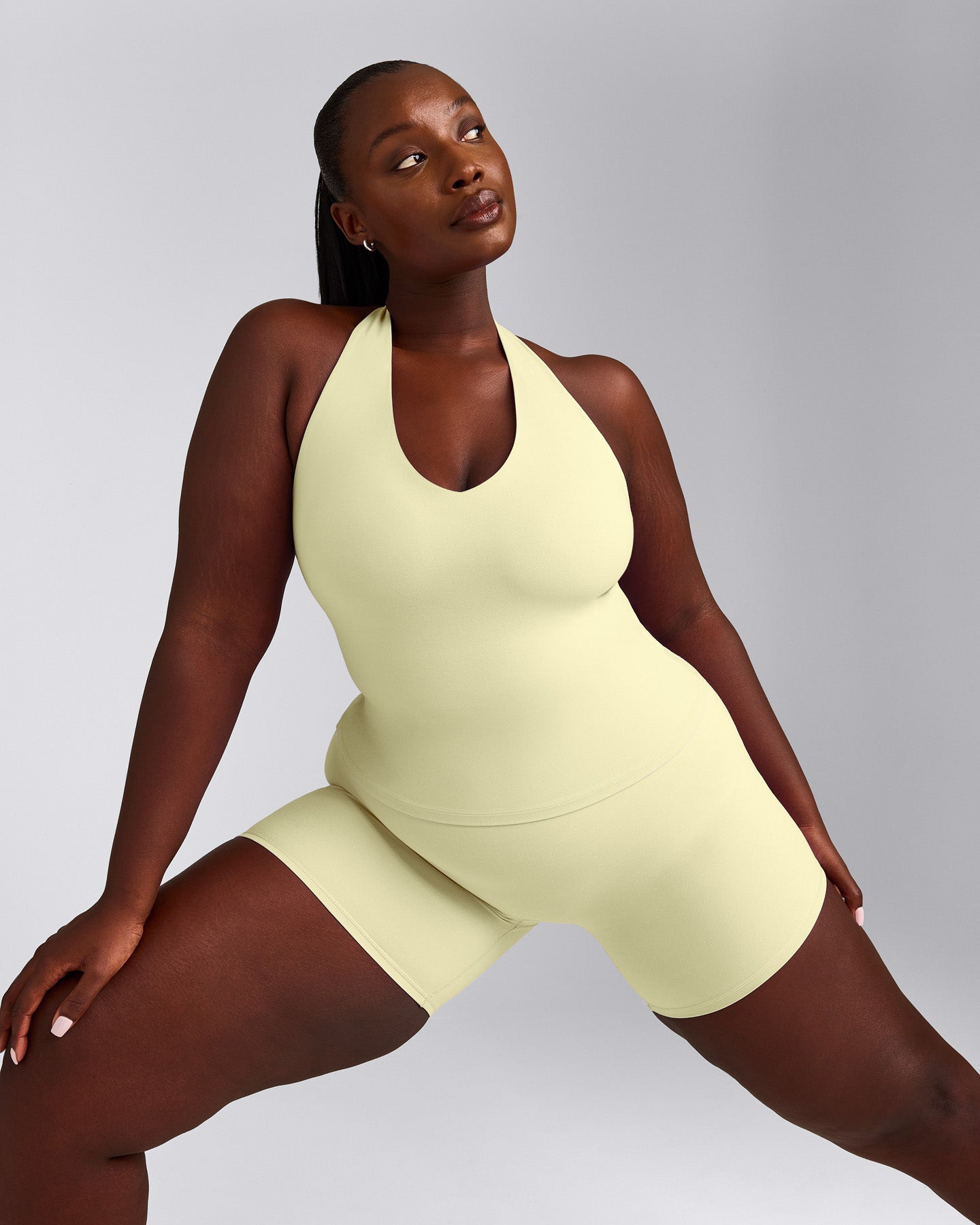 SoftMotion™ Halter Neck Tank Top with Built in Bra Shelf with Grey Logo | Pastel Yellow