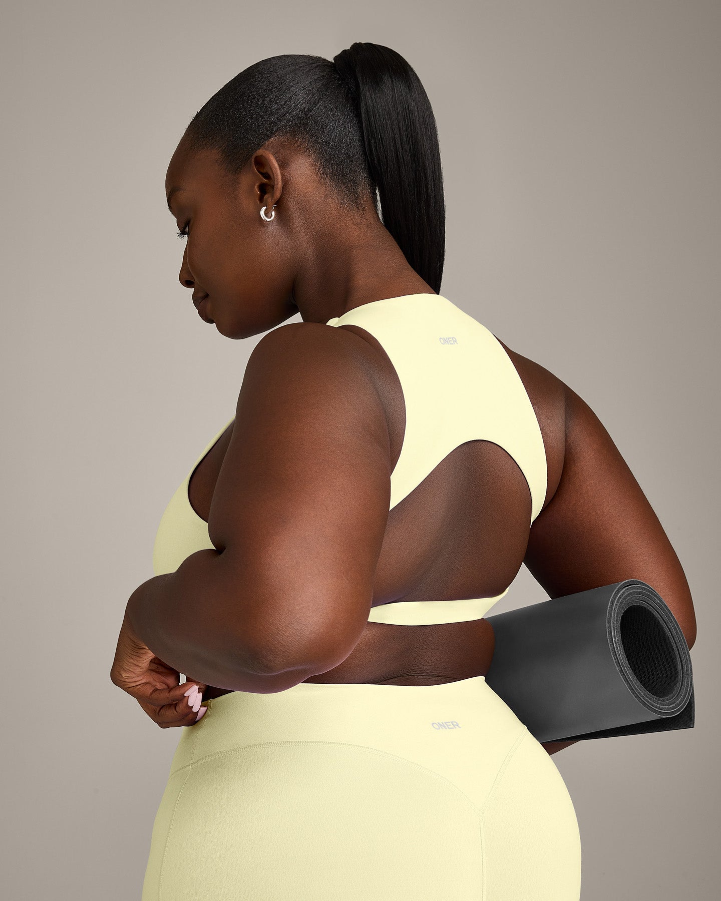 SoftMotion™ High Neck Sports Bra with Grey Logo | Pastel Yellow
