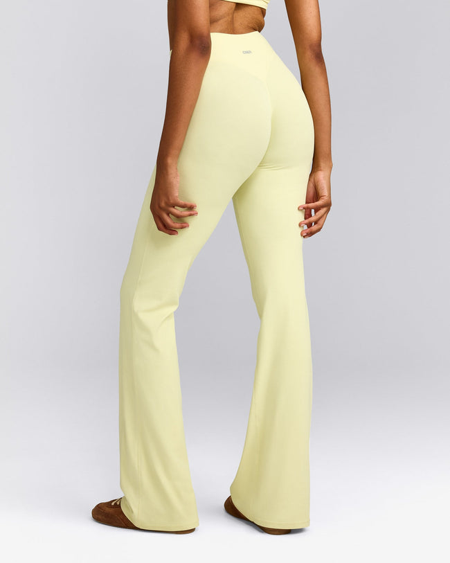 SoftMotion™ Flared Pants with Grey Logo | Pastel Yellow