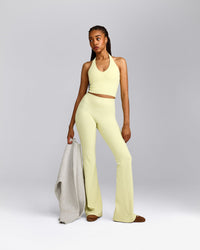 SoftMotion™ Flared Pants with Grey Logo | Pastel Yellow