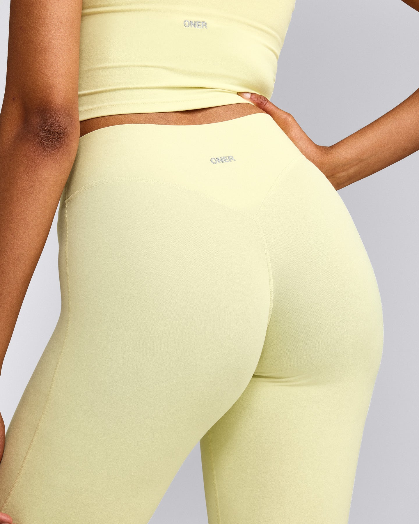 SoftMotion™ Flared Pants with Grey Logo | Pastel Yellow