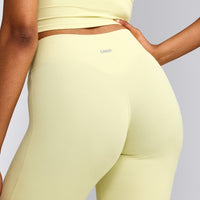 SoftMotion™ Flared Pants with Grey Logo | Pastel Yellow