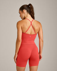 EnhanceLift™ Seamless Strappy Racer Vest with Built in Bra Shelf with Grey Logo | Dark Charged Coral