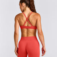EnhanceLift™ Seamless Strappy Sports Bra with Grey Logo | Dark Charged Coral