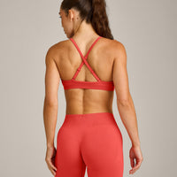 EnhanceLift™ Seamless Strappy Sports Bra with Grey Logo | Dark Charged Coral