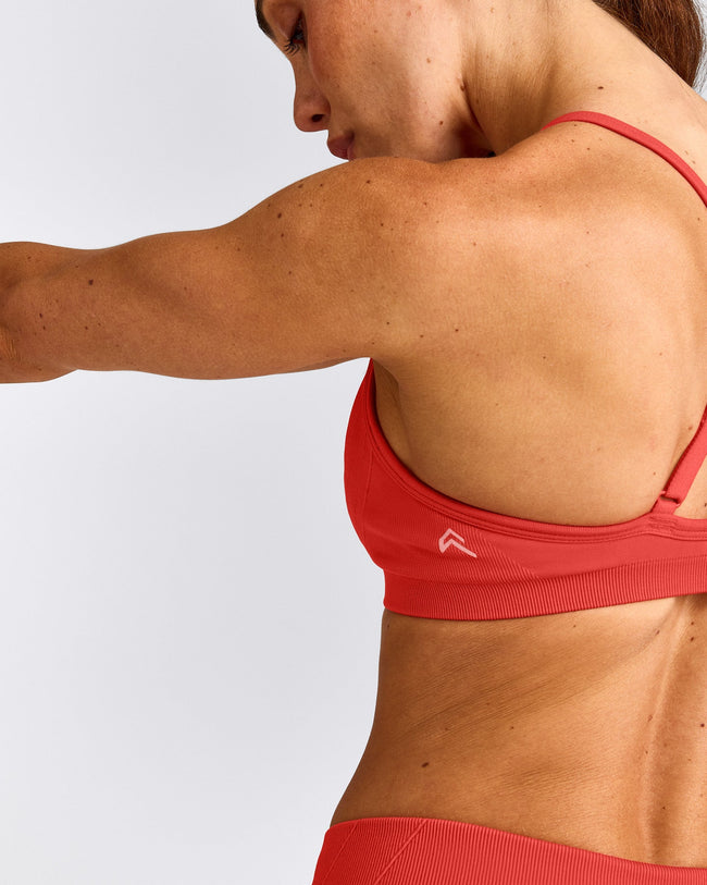 EnhanceLift™ Seamless Strappy Sports Bra with Grey Logo | Dark Charged Coral