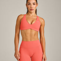 UnifiedMove™ Cross Back Sports Bra with Reflective Logo | Light Charged Coral