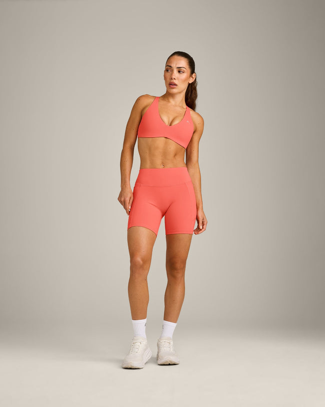 UnifiedMove™ Cross Back Sports Bra with Reflective Logo | Light Charged Coral