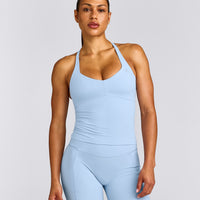 UnifiedMove™ T Back Mid Vest with Built in Bra Shelf with Reflective Logo | Powdered Blue