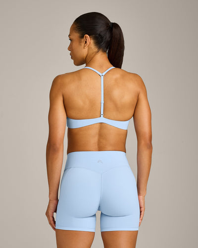 UnifiedMove™ T Back Minimal Bralette with Reflective Logo | Powdered Blue