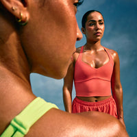 UnifiedMove™ T Back Mid Vest with Built in Bra Shelf with Reflective Logo | Light Charged Coral