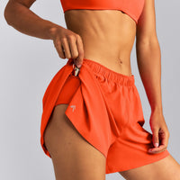 AirMove™ Lined Pocket Shorts 4" | Energy Orange