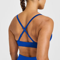EnhanceLift™ Seamless Strappy Sports Bra with White Logo | Cobalt Blue