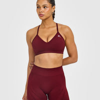 EnhanceLift™ Seamless Strappy Sports Bra with White Logo | Rosewood
